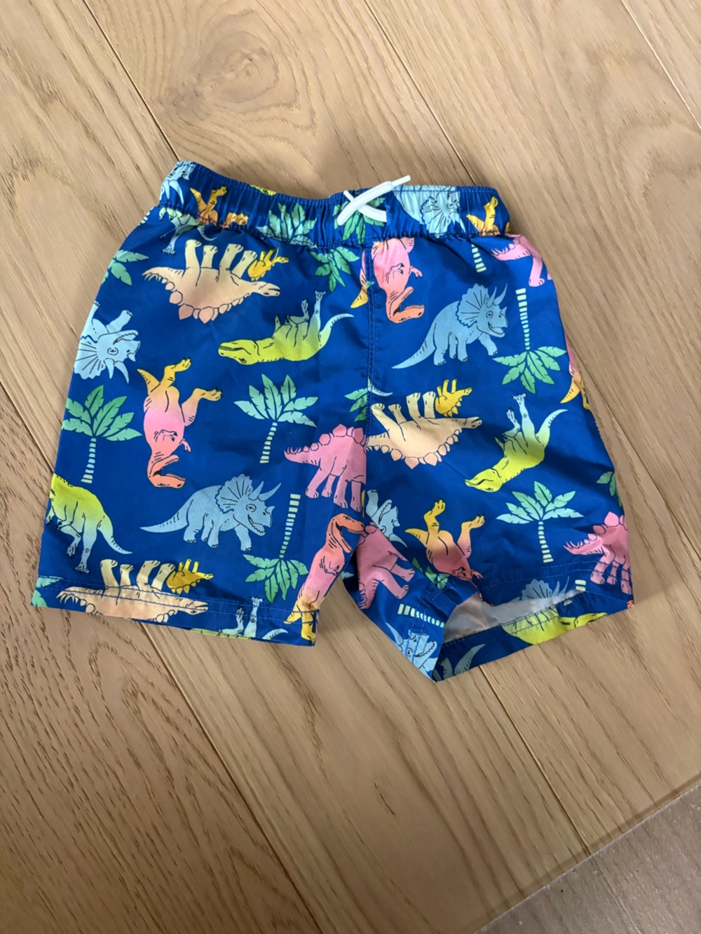 Old Navy dinosaur swim trunks - size 4